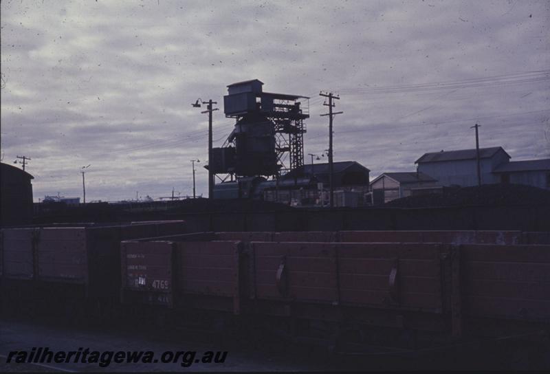 T01234
R class 4769 bogie open wagon, coaling tower, Bunbury. R 4769 entered service in 1900, converted to a QBB class flat wagon in 1970 and written off in 1973.
