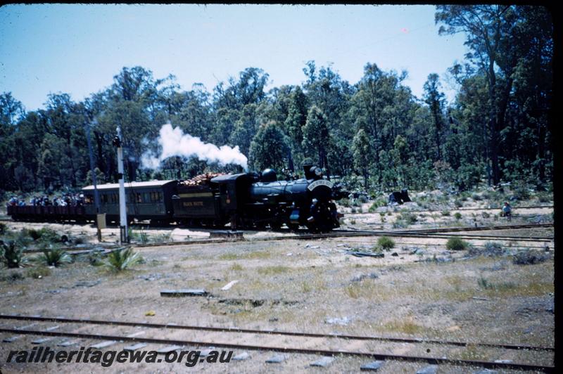 T03058
Hawker Sidderley Building Supplies loco, ex WAGR CS class 270, Black Butte on the Banksiadale timber mill line crossing over the PN line, Wuraming, AA class 206 first class carriage and two R class wagons with passengers behind the loco, ARHS tour train. 
