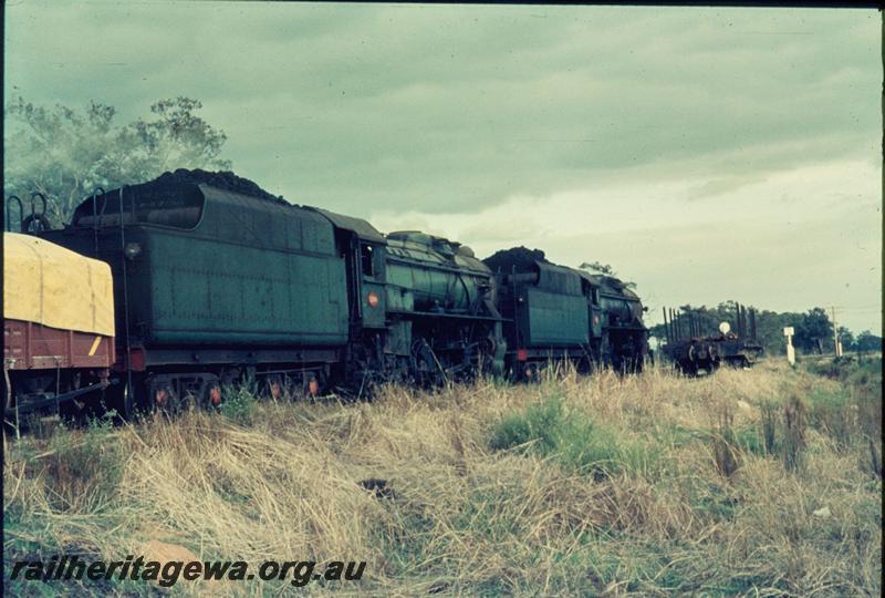 T03304
Double headed V classes, goods train, view from rear looking forward, wagon with a yellow tarpaulin
