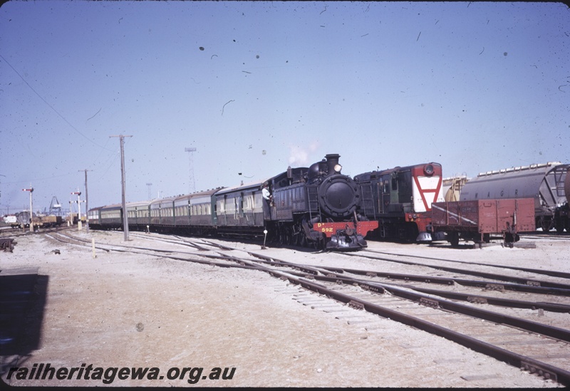 T04374
DD Class 592, heading passenger train, Y Class diesel shunter, signal posts, Leighton Yard, ER line
