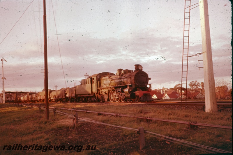 T05208
PM class 719, on goods train, signals, rodding, houses, side and front view
