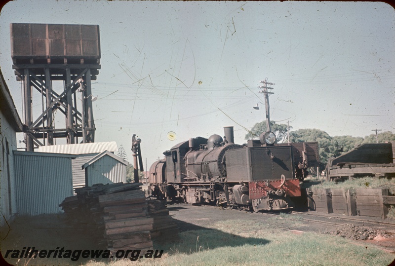 T05228
MSA class 497, water tower, 25,000 gallon cast iron tank, water column, sleeper pile, trackside buildings, wagon (part only), Busselton loco depot, BB line, side and front view
