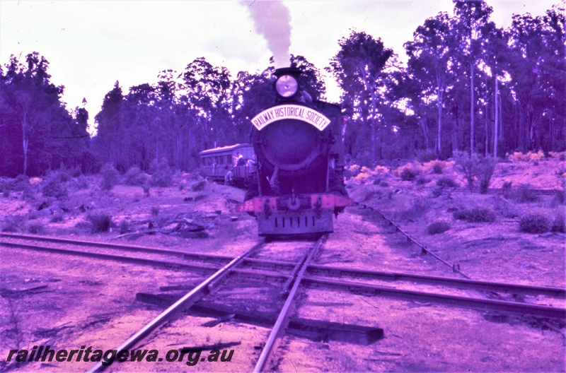 T05480
Hawker Sidderley Building Supplies loco, ex WAGR CS class 270, Black Butte on the Banksiadale timber mill line approaching the  crossing over the PN line, Wuraming, two R class wagons with passengers and  AA class 206 first class carriage behind the loco, tour train for the ARHS Vic Division.
