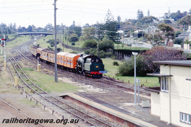 T05499
HVR W class tender first, hauling a passenger train approaching Cottesloe. ER line.
