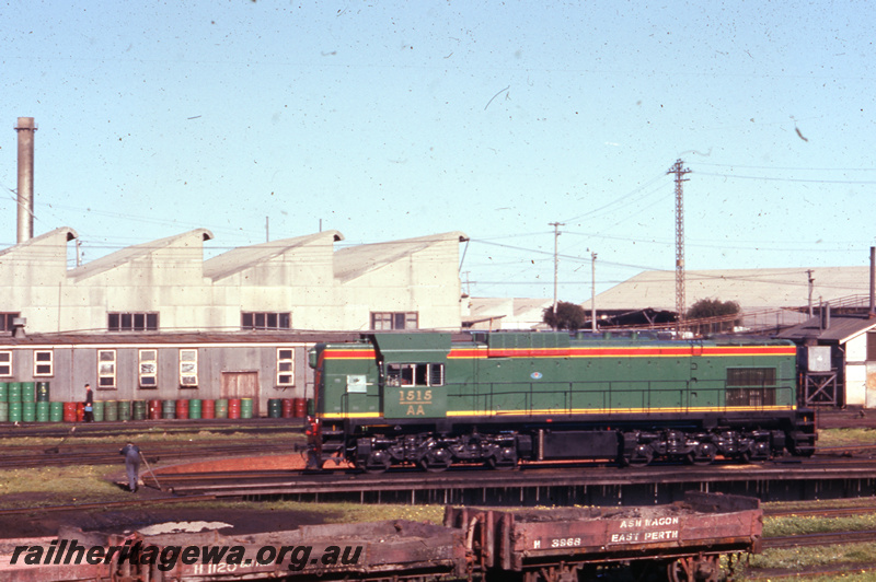 T05656
1 of 3 views of AA class 1515 as new, East Perth Loco Depot , on turntable, side view, ash wagons H class 1120 and H class 3968 in the foreground
