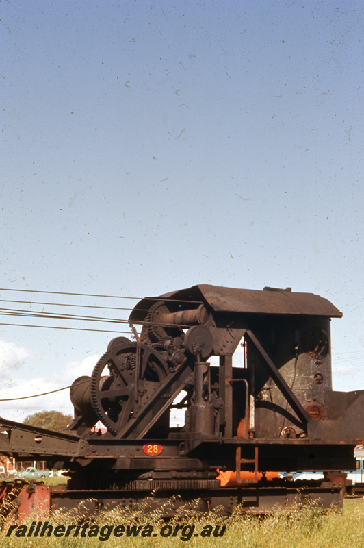 T05664
Steam crane No. 28, East Perth Loco Depot, front and side view of the cab showing the piston and winding gear
