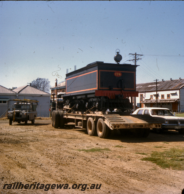 T05669
Tender from loco R class 174 on low loader being prepared for transport from Midland Railway Institute to the Centrepoint Shopping Centre at Midland. 
