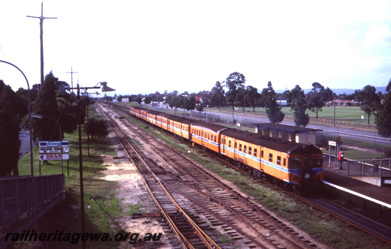 T05672
Ashfield Station - 8 car ADG/ADA/ADX railcar approaching  platform. ER line.
