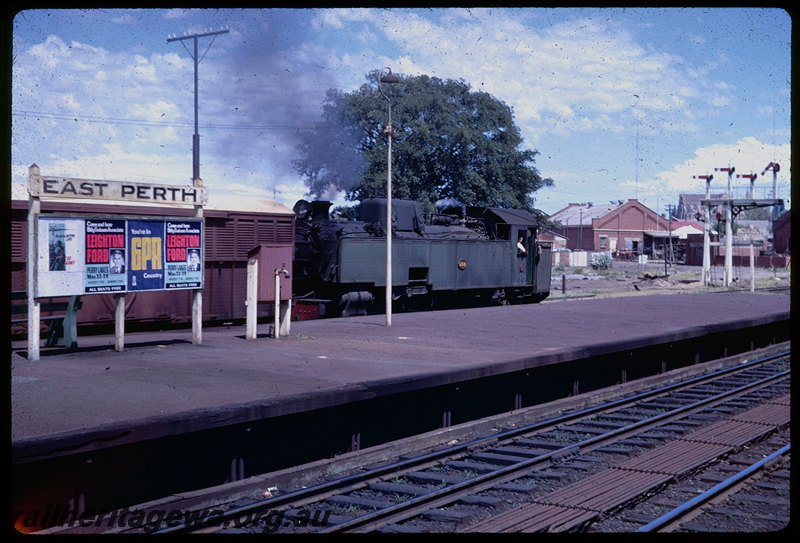 T06020
UT Class 664 on Up goods train through East Perth Station, station nameboard, semaphore bracket signal, SWR line
