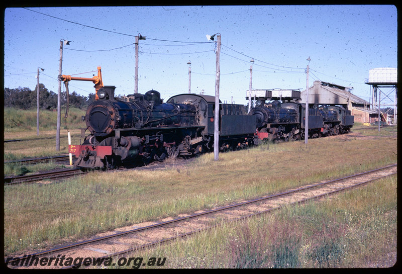 T06388
PM/PMR Class steam locomotives stored at Collie loco depot, PM Class 717, connecting rod removed, water column, water tank, running shed
