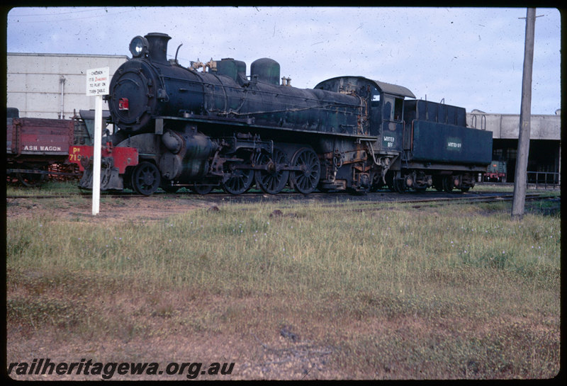 T06399
PM Class 710, written off, connecting rod removed, red lantern hung on smokebox, Collie loco depot, roundhouse, turntable, ash wagon, warning sign, 