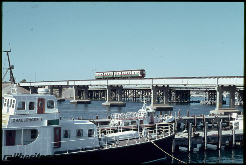 T07086
ADG/ADA Class railcar set, Up suburban passenger service, crossing Swan River Bridge, steel girder, concrete pylon, Fremantle, ER line
