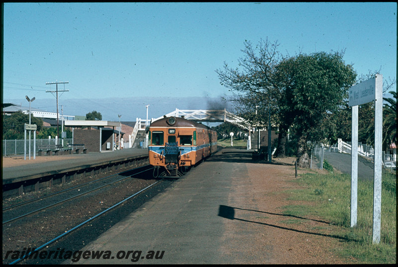 T07401
ADA/ADX Class railcar set, Down suburban passenger service, West Leederville, platform, station nameboard, shelters, footbridge, ER line
