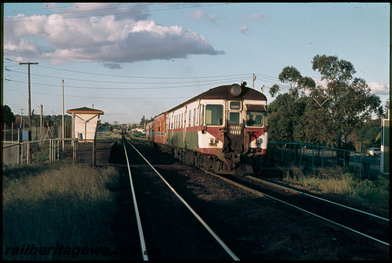 T07444
ADG/AYE/ADG Class railcar set, Up surburban service, departing Loch Street, platform, shelters, pedestrian maze, ER line
