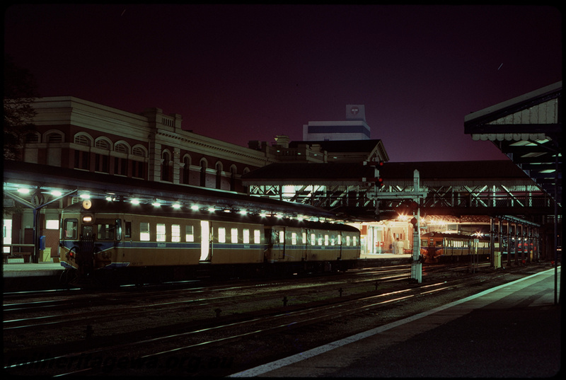 T07750
ADA Class 761 with ADG Class railcar, Down suburban passenger service, Platform 4, three-car ADG Class railcar set, Platform 2, City Station, Perth, station buildings, semaphore signal, footbridge, ER Line
