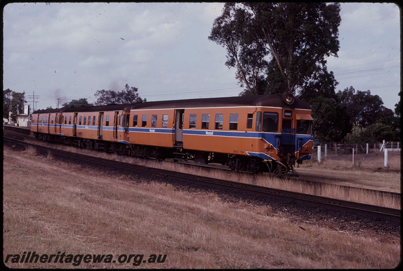 T07838
ADA Class 754 with ADH/ADG Class railcar set, Down suburban passenger service, departing Stokely, platform, station shelter, SWR line
