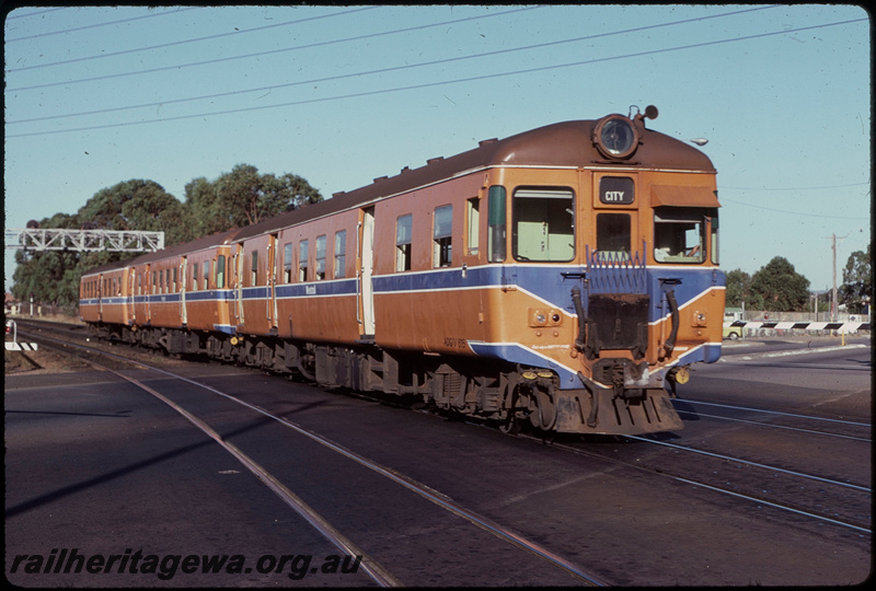 T07888
ADG Class 615 with ADA Class trailer, Up suburban passenger service, between Clasiebrook and City, Moore Street level crossing, searchlight gantry signal, ER line
