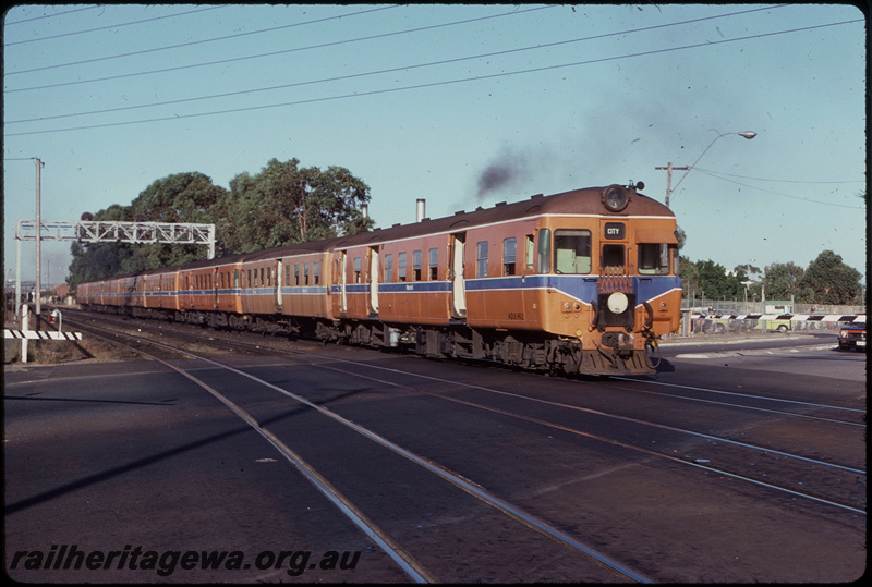 T07889
ADX/ADA/ADX/ADA/ADX/ADA/ADX/ADA Class railcar set, Down suburban passenger service,  between City and Clasiebrook, Moore Street level crossing, searchlight gantry signal, ER line
