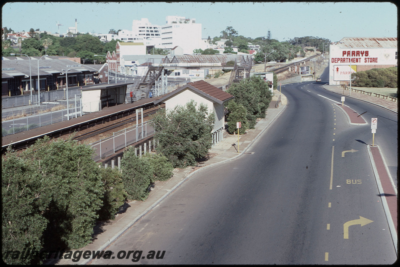 T08147
West Perth Station, looking towards Fremantle, footbridge, station shelters, platforms, station nameboard, Perth Metropolitan Markets, Roe Street, ER line
