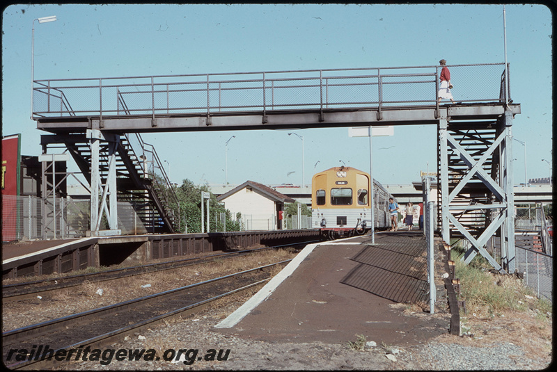 T08159
ADL/ADC Class railcar set, Up suburban passenger service, West Perth, footbridge, platforms, station shelters, ER line
