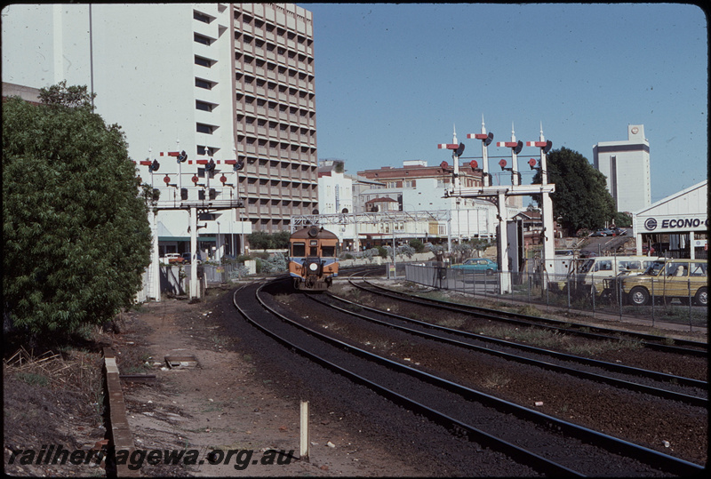T08169
Single ADG Class railcar, Up suburban passenger service, approaching City Station, Perth, Pier Street pedestrian crossing, semaphore bracket signals, searchlight signal gantry, ER line
