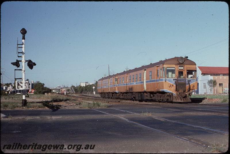 T08170
ADG Class 610 with another ADG Class railcar, Down suburban passenger service, departing Maylands, Caledonian Street level crossing, ER line
