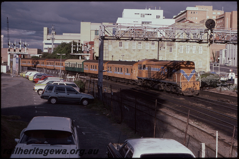 T08193
C Class 1701, Up suburban passenger service, approaching City Station, Pier Street pedestrian crossing, searchlight signal gantry, semaphore bracket signals, Perth, ER line
