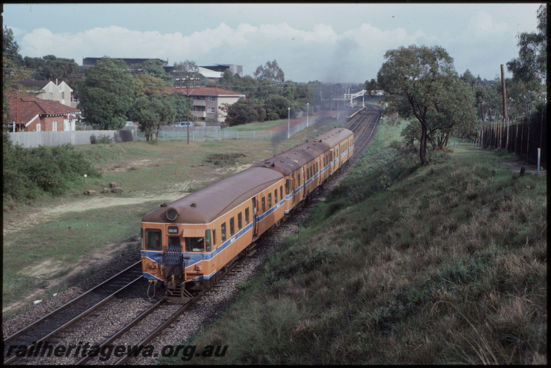 T08222
ADA/ADG/ADG Class railcar set, Down suburban passenger service, departing West Leederville, footbridge, station shelter, platform, ER line
