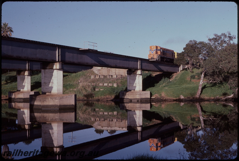 T08247
A Class 1502, Down suburban passenger service, Z Class brakevan, Swan River Bridge, concrete pylons, steel girder, Guildford, ER line
