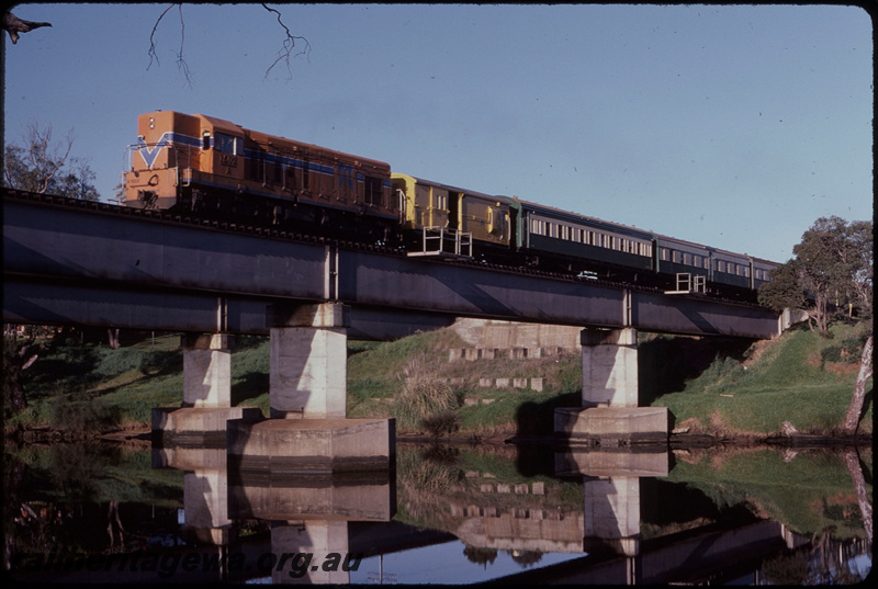 T08248
A Class 1502, Down subuuban passenger service, Z Class brakevan, ARM Class sleeping carriage on hire from Hotham Valley, AYC Class Australind carriages, coaching set used temporarily to release ADL/ADC Class railcars for modification for two man working, Swan River Bridge, concrete pylons, steel girder, Guildford, ER line
