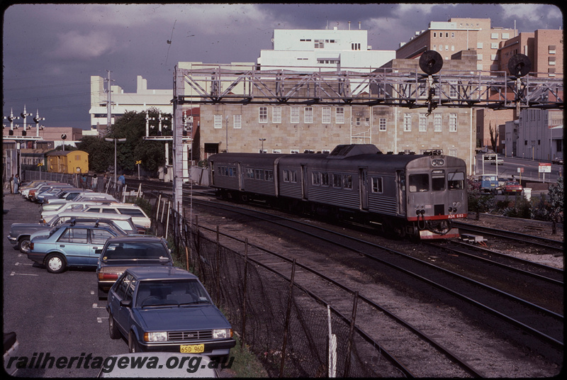 T08253
ADK Class 683 with ADB Class trailer, Up suburban passenger service, approaching City Station, Pier Street pedestrian crossing, searchlight signal gantry, semaphore bracket signals, Perth, ER line
