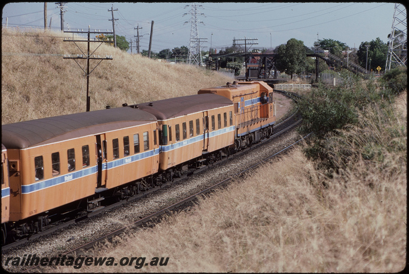 T08309
A Class 1502, Down suburban passenger service, ADA Class trailers and de-engined ADX Class railcars in consist, approaching Victoria Park, footbridge, SWR line

