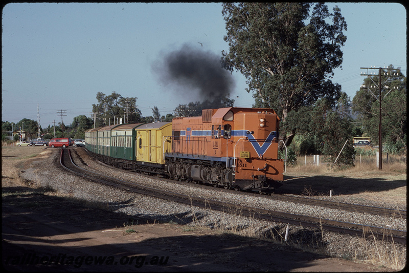 T08369
A Class 1511, Down suburban passenger service, departing Stokley, Albany Highway level crossing, SWR line

