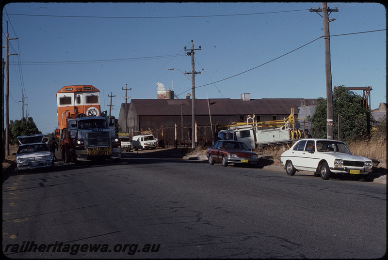 T08386
Mount Newman Mining GE C36-7M 5506 (rebuilt from ALCo C636 5455), on Bell Brothers low-bed trailer, leaving A Goninan & Co, Welshpool bound for the Pilbara
