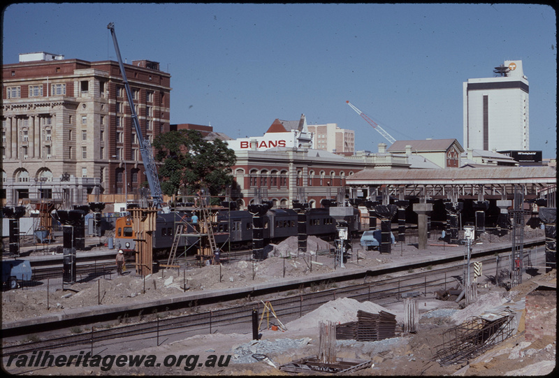 T08401
ADL/ADC Class railcar set, Up suburban passenger service, arriving at City Station, construction of multi-story carpark underway, station building, footbridge, Perth, ER line
