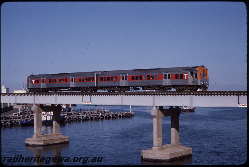 T08483
Two car ADL/ADC class railcar set with the wide red stripe on the side, Up suburban passenger service, Swan River Bridge, steel girder, concrete pylon, Fremantle, ER line
