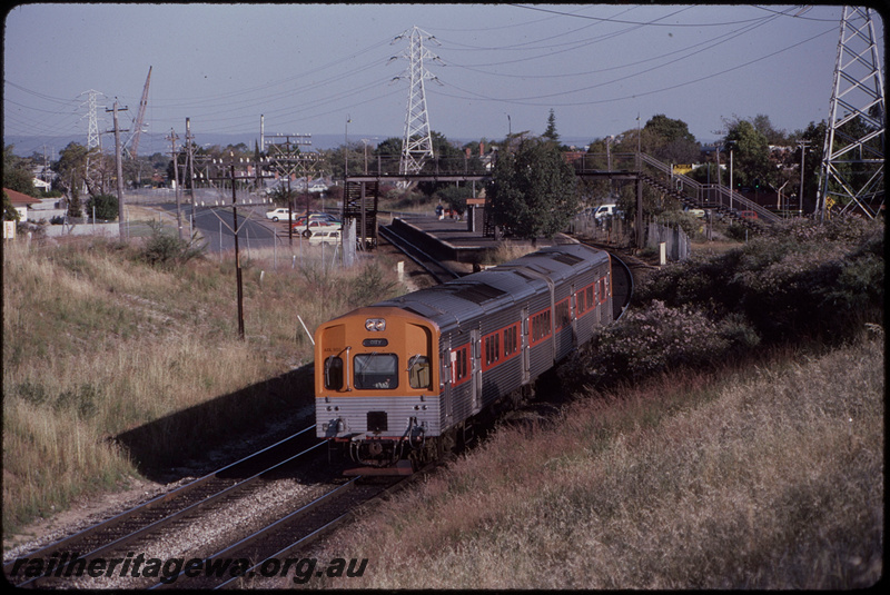 T08487
ADL Class 803 with an ADC Class trailer, Up suburban passenger service, departing Victoria Park, platform, station shelter, footbridge, SWR line
