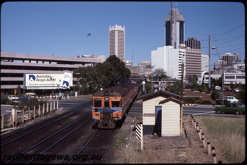 T08497
ADG Class 612 with an ADG/ADA/ADG Class railcar set, Down suburban passenger service, Lord Street level crossing, between Claisebrook and City, ER line

