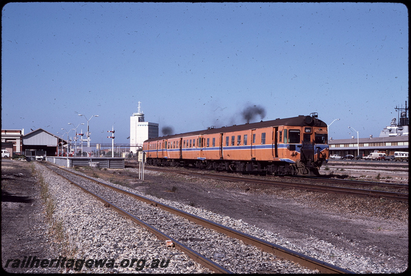 T08600
ADG Class 613 with an ADA/ADG Class railcar set, Down suburban passenger service, departing Fremantle, station building, platform, semaphore signals, ER line
