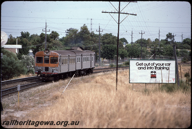 T08614
ADB Class 780 with an ADK Class railcar, Down suburban passenger service, between Oats Street and Welshpool, Transperth advert on billboard with slogan 