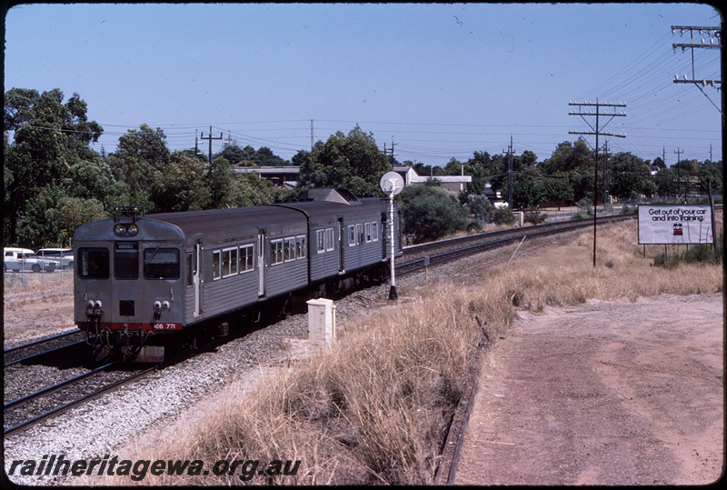 T08615
ADB Class 771 and ADK Class 681, Down suburban passenger service, between Oats Street and Welshpool, searchlight signal, relay box, Transperth advert on billboard with slogan 