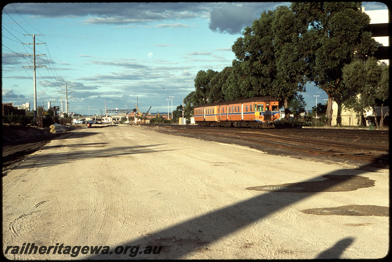 T08633
ADG/ADA Class railcar set, Up suburban passenger servoce, between City Station and Claisebrook, searchlight signal gantry, Lord Street level crossing, ER line
