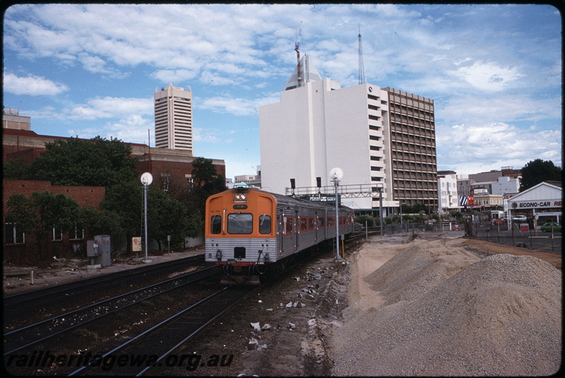 T08644
ADC Class 854 and ADL Class 804, Down suburban passenger service, between City Station and Claisebrook, Moore Street level crossing, earthworks underway for construction of additional trackwork and McIver Station, ER line
